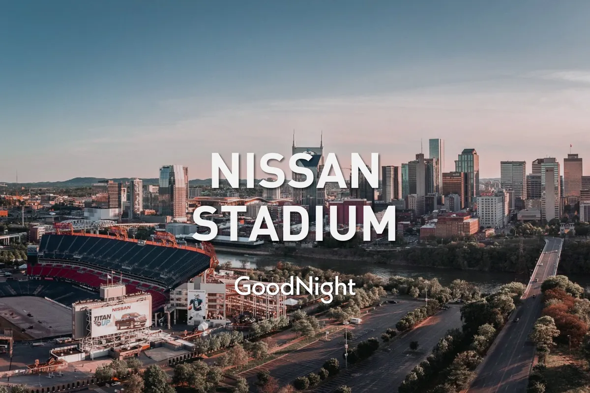A wide-angle view featuring Nissan Stadium, Downtown Nashville, and Riverfront Park. The scene is lively, with a sense of bustling city events, concerts, and sports activities.