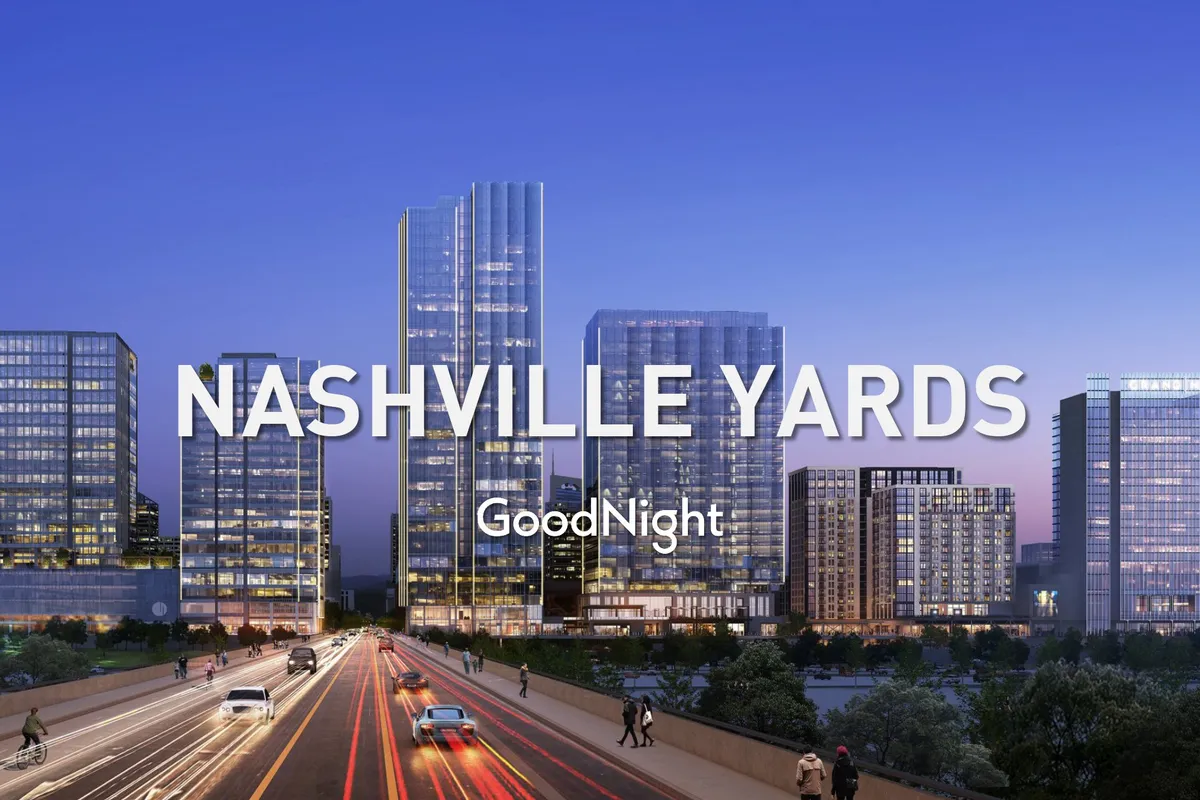 An exterior cityscape with tall glass buildings, a busy roadway, and the city skyline, radiating a vibrant, modern urban energy. This angle showcases the broader downtown context and the dynamic setting guests can access easily.
